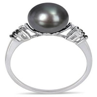 Prsten od bijelog zlata od 10 karata s crnim tahitijskim kultiviranim biserima i crno-bijelim dijamantom.